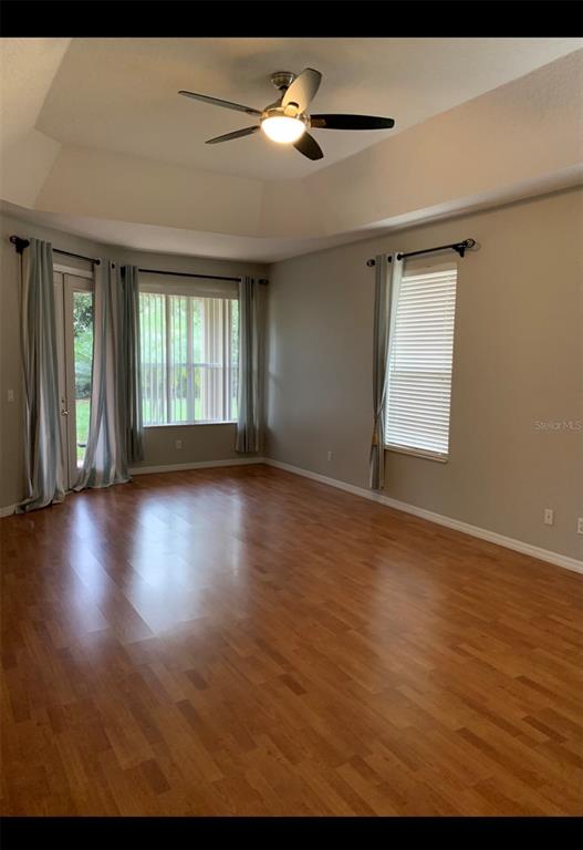 761 Broadoak Loop Sanford, FL 32771 - Photo 10 of 22 a view of an empty room with window and wooden floor