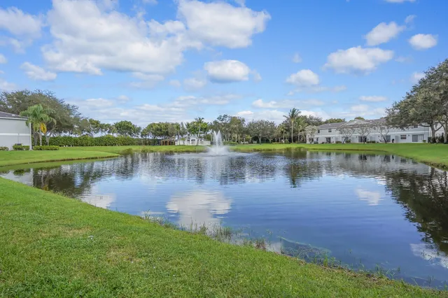 a view of a lake with houses in the back
