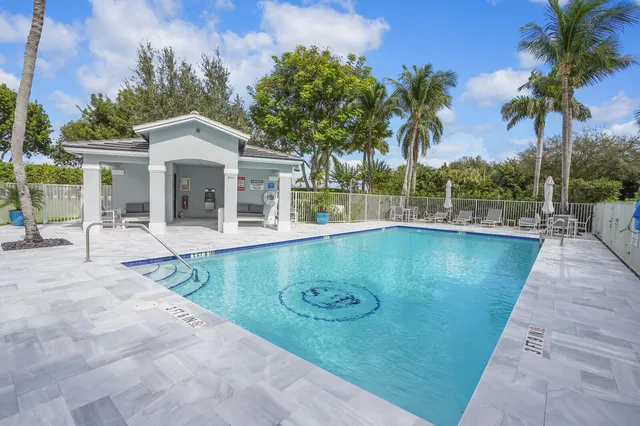 a view of a house with backyard and porch