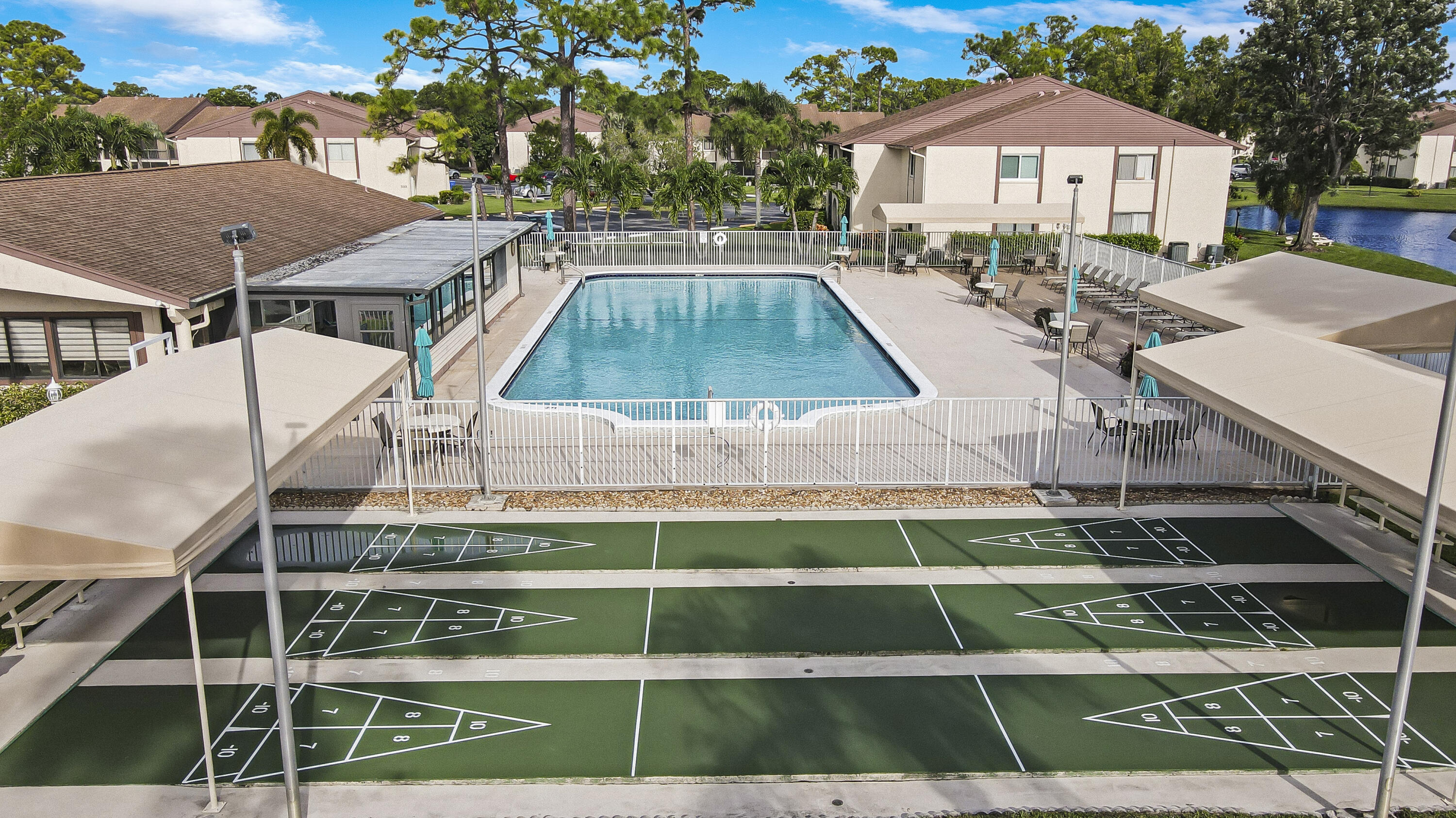 335 Knotty Pine Circle, Unit D1 Greenacres, FL 33463 - Photo 2 of 18 a view of a house with a yard