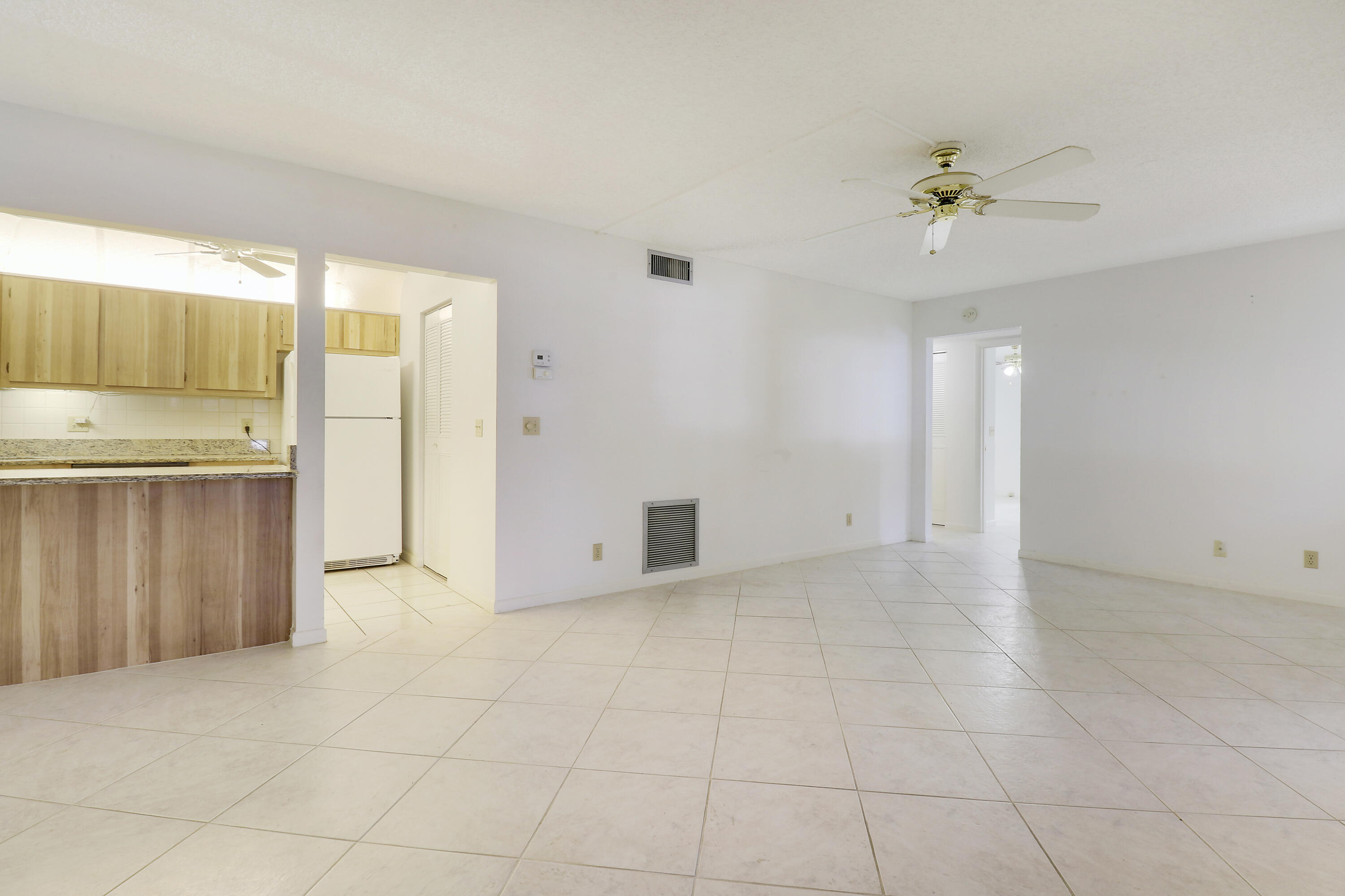 335 Knotty Pine Circle, Unit D1 Greenacres, FL 33463 - Photo 3 of 18 a view of an empty room with a window