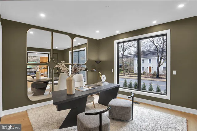a living room with dining table and wooden floor