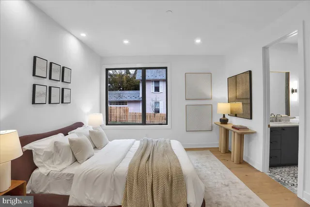 a bedroom with a large bed and a window