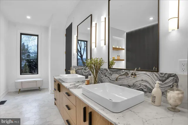 a bedroom with a bed and a sink