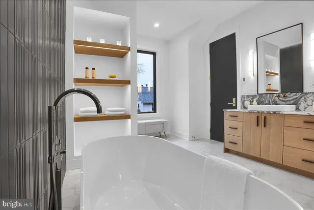 a bathroom with a bathtub and shower