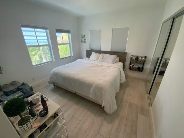 a bedroom with a bed and window