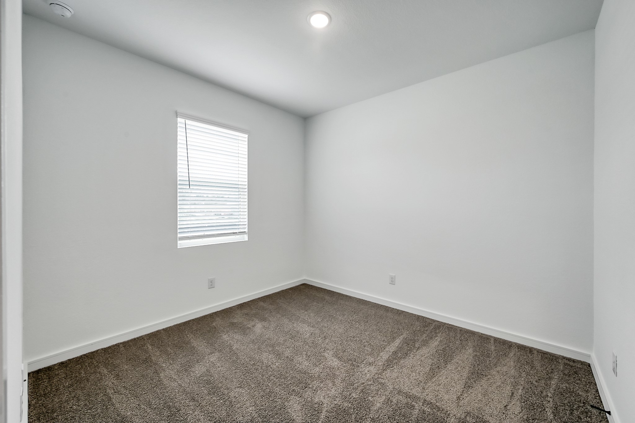 516 Monarch Trail Huntsville, TX 77340 - Photo 15 of 20 an empty room with a window