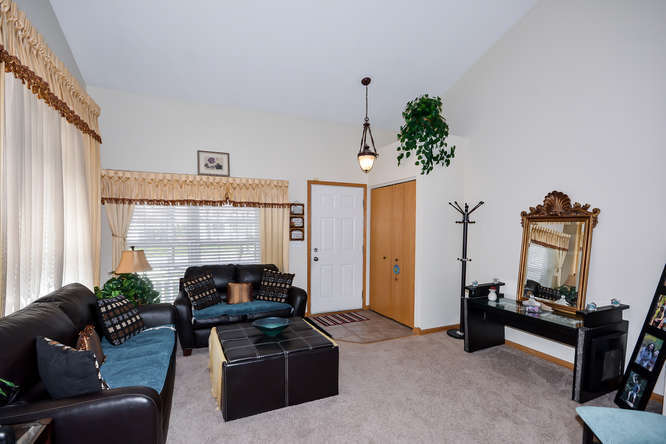 796 Teasel Lane Aurora, IL 60504 - Photo 12 of 37 a living room with furniture and a fireplace
