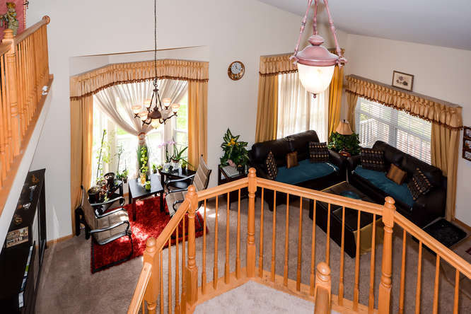 796 Teasel Lane Aurora, IL 60504 - Photo 14 of 37 a front view of a house with wooden floor