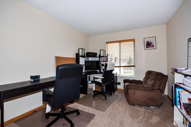 796 Teasel Lane Aurora, IL 60504 - Photo 15 of 37 a view of a workspace with furniture and a window