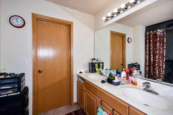 796 Teasel Lane Aurora, IL 60504 - Photo 20 of 37 a bathroom with a double vanity sink and a mirror