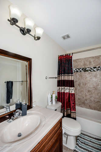 796 Teasel Lane Aurora, IL 60504 - Photo 23 of 37 a bathroom with a sink toilet and shower