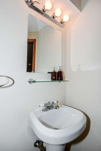 796 Teasel Lane Aurora, IL 60504 - Photo 29 of 37 a bathroom with a sink and a mirror