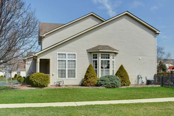 796 Teasel Lane Aurora, IL 60504 - Photo 31 of 37 a front view of a house with a yard and garage