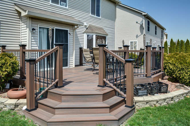796 Teasel Lane Aurora, IL 60504 - Photo 32 of 37 a view of a house with wooden deck and furniture