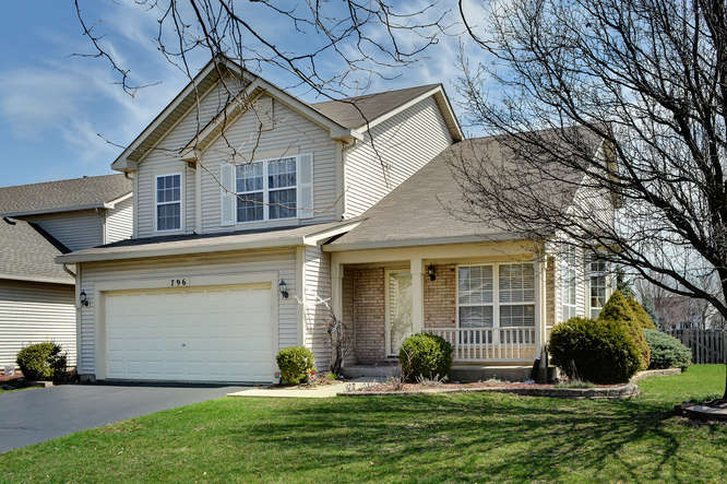 796 Teasel Lane Aurora, IL 60504 - Photo 35 of 37 a front view of a house with a yard and garage