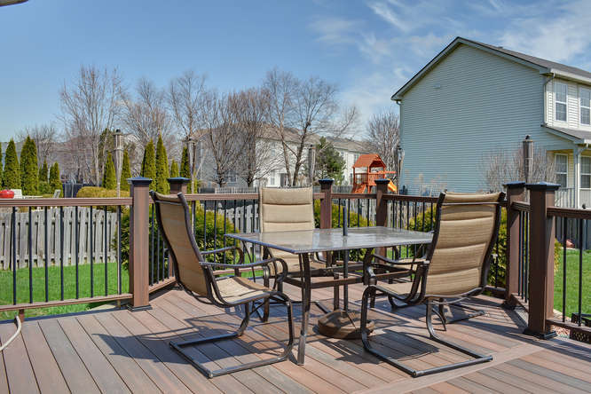 796 Teasel Lane Aurora, IL 60504 - Photo 36 of 37 a view of a chairs and table on the deck
