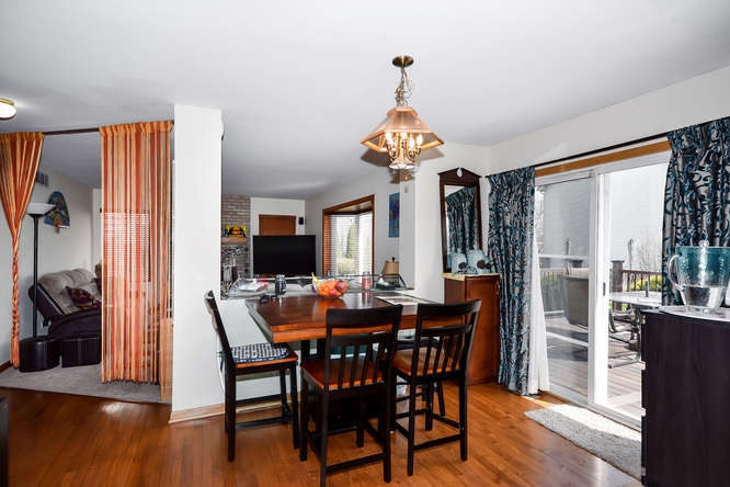 796 Teasel Lane Aurora, IL 60504 - Photo 4 of 37 a view of a dining room with furniture window and wooden floor