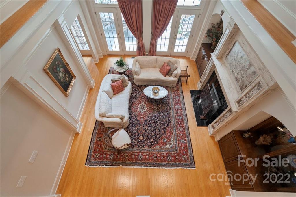 312 Devonport Drive Matthews, NC 28104 - Photo 12 of 48 a living room with furniture and a fireplace