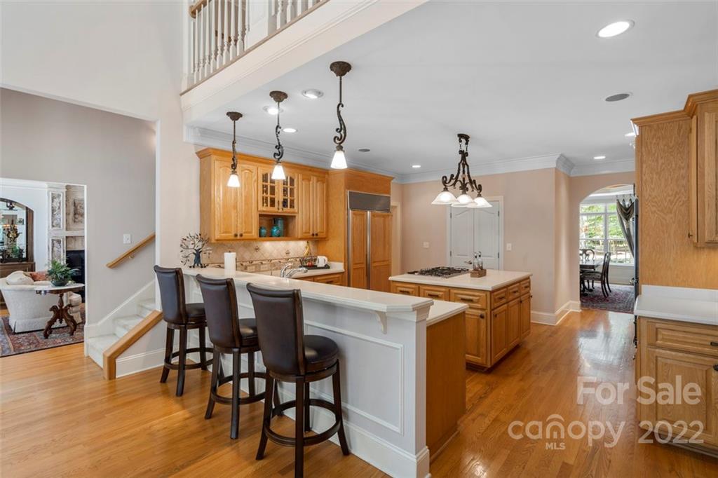 312 Devonport Drive Matthews, NC 28104 - Photo 17 of 48 a kitchen with a dining table chairs stove and kitchen view