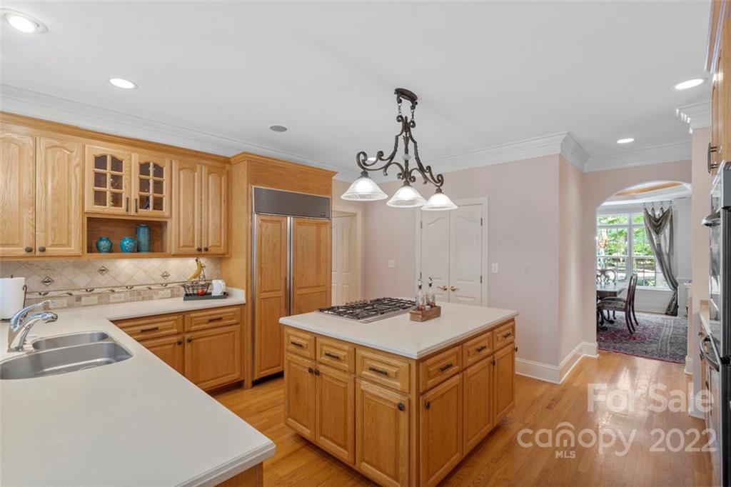 312 Devonport Drive Matthews, NC 28104 - Photo 18 of 48 a kitchen that has a lot of cabinets in it and wooden floors