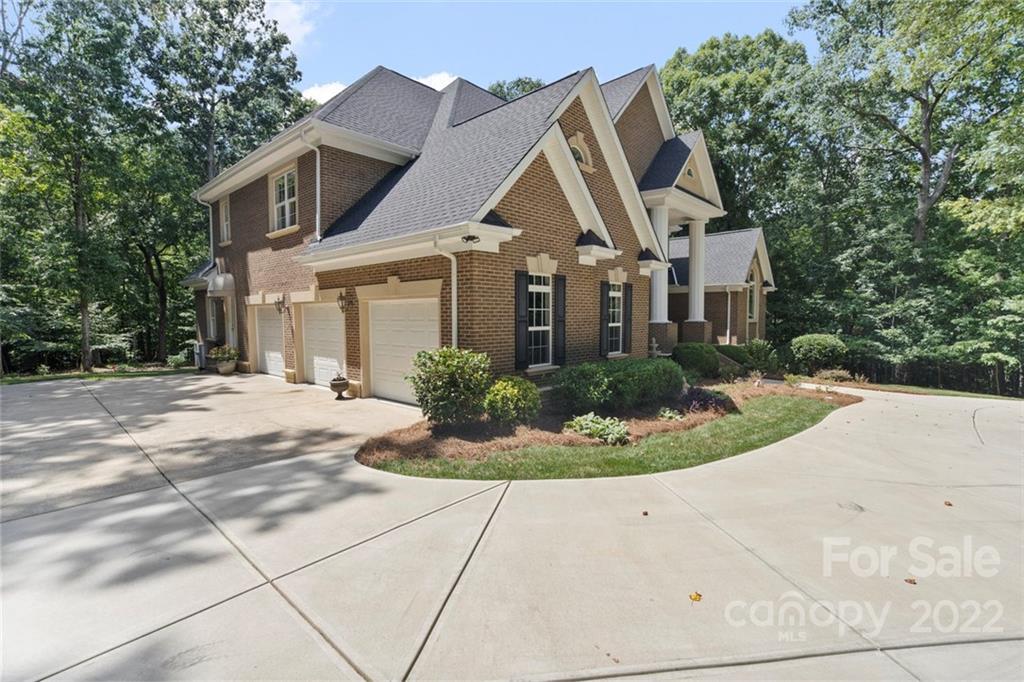 312 Devonport Drive Matthews, NC 28104 - Photo 2 of 48 a front view of a house with a yard