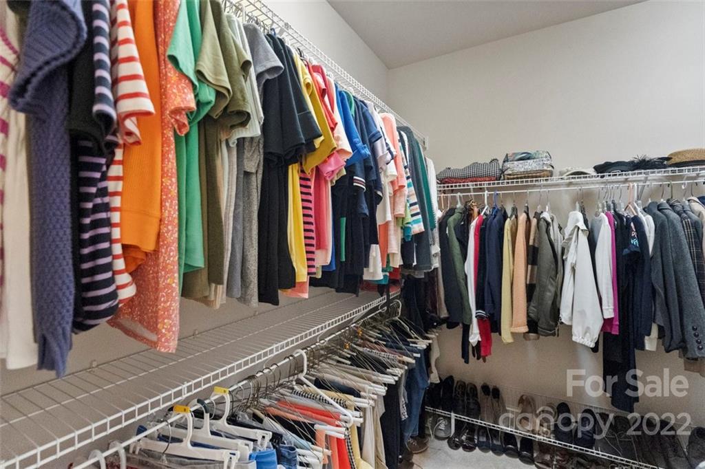 312 Devonport Drive Matthews, NC 28104 - Photo 33 of 48 a view of walk in closet with clothes and shoes