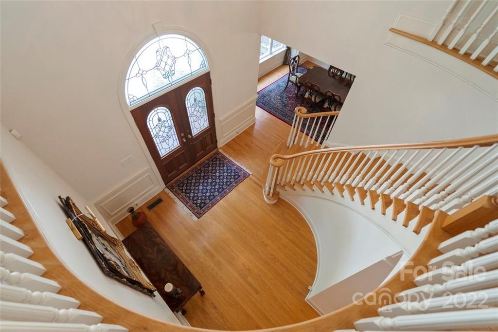 312 Devonport Drive Matthews, NC 28104 - Photo 37 of 48 a view of staircase with a rug