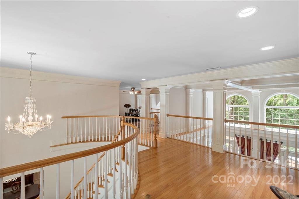 312 Devonport Drive Matthews, NC 28104 - Photo 39 of 48 a view of an entryway with wooden floor