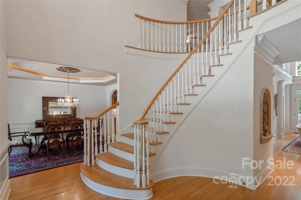 312 Devonport Drive Matthews, NC 28104 - Photo 4 of 48 a view of entryway and hall with wooden floor