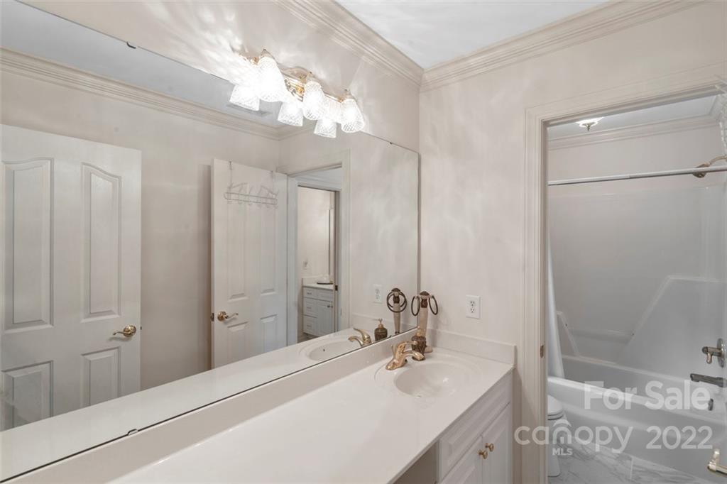 312 Devonport Drive Matthews, NC 28104 - Photo 43 of 48 a bathroom with a sink and a mirror