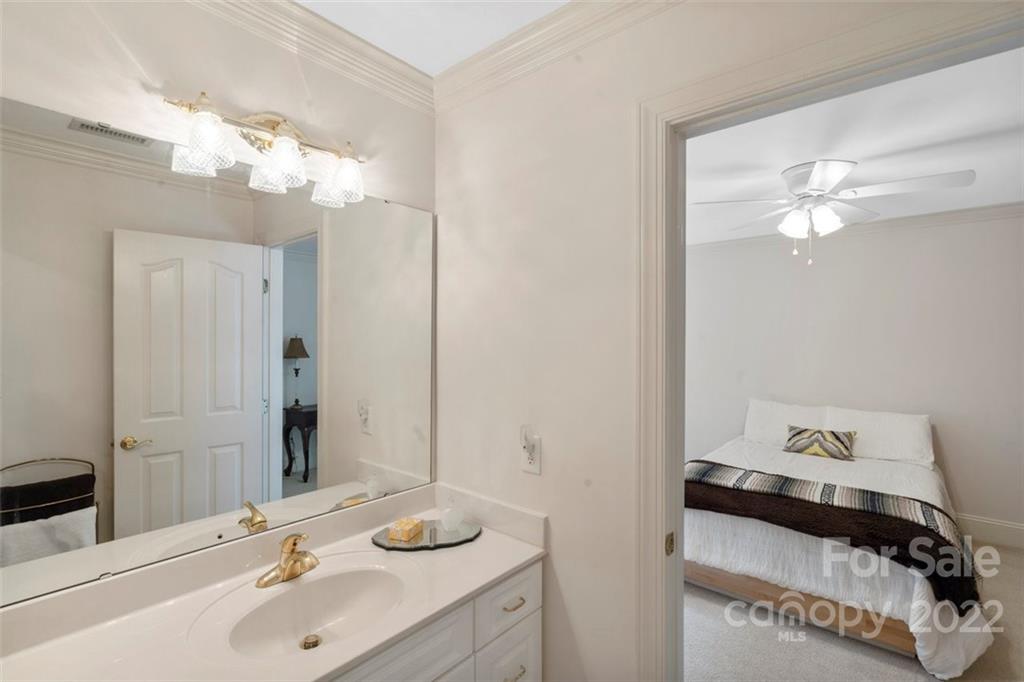 312 Devonport Drive Matthews, NC 28104 - Photo 44 of 48 a bathroom with a sink and a mirror
