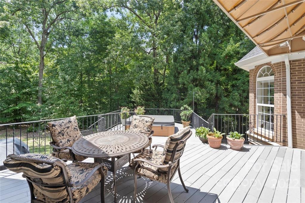 312 Devonport Drive Matthews, NC 28104 - Photo 46 of 48 a view of a table and chairs on the roof deck
