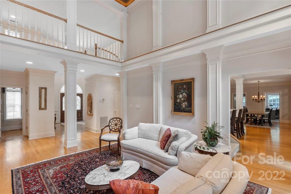 312 Devonport Drive Matthews, NC 28104 - Photo 9 of 48 a living room with furniture and wooden floor