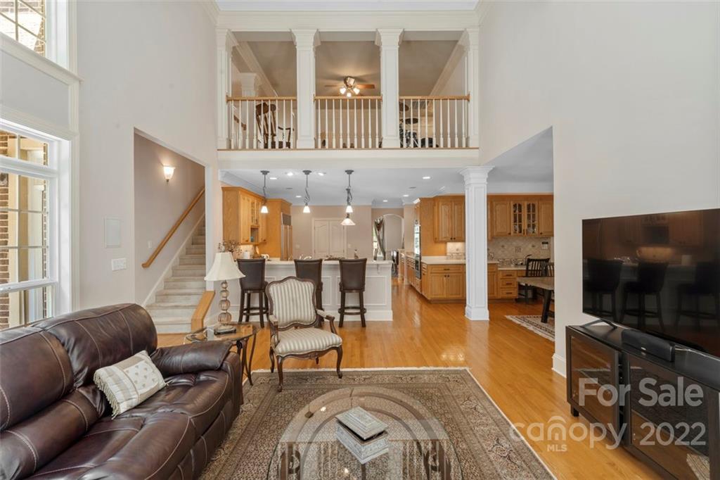 312 Devonport Drive Matthews, NC 28104 - Photo 10 of 48 a living room with furniture and a flat screen tv