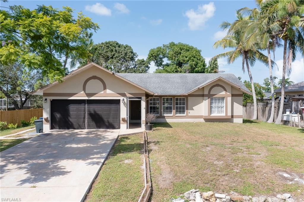 18422 Sunflower Road Fort Myers, FL 33967 - Photo 1 of 26 a front view of a house with a yard