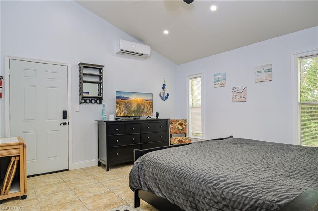 18422 Sunflower Road Fort Myers, FL 33967 - Photo 13 of 26 a bedroom with a bed and a dresser
