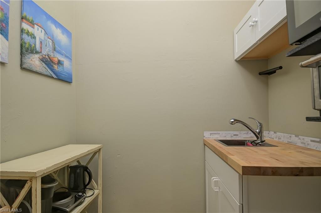 18422 Sunflower Road Fort Myers, FL 33967 - Photo 17 of 26 a bathroom with a sink and a mirror