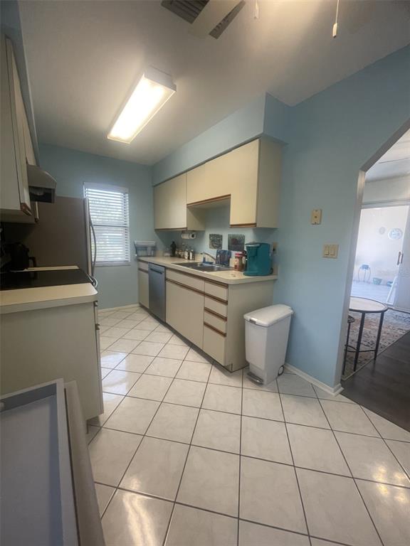 25068 Harbor View Road, Unit 3D Punta Gorda, FL 33980 - Photo 12 of 24 a kitchen with a sink a stove and cabinets