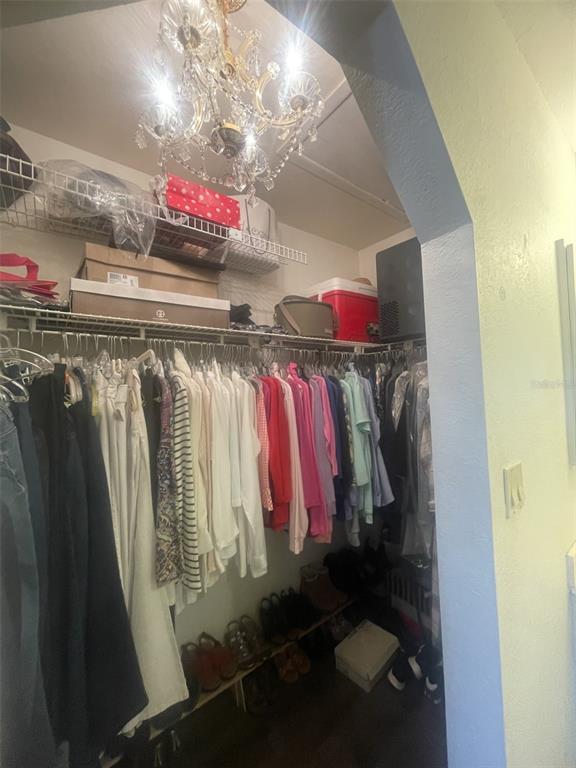 25068 Harbor View Road, Unit 3D Punta Gorda, FL 33980 - Photo 23 of 24 a view of walk in closet with clothes and shoes