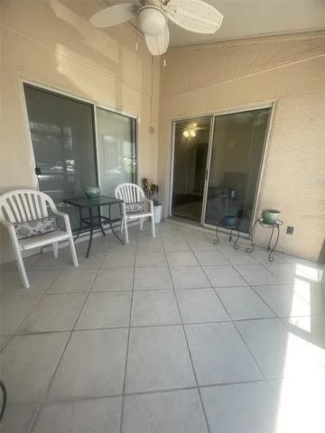 a outdoor space with white walls and tiles