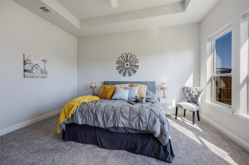 1617 Hitching Post Road Weston, TX 75009 - Photo 17 of 30 a bedroom with a bed and lamp