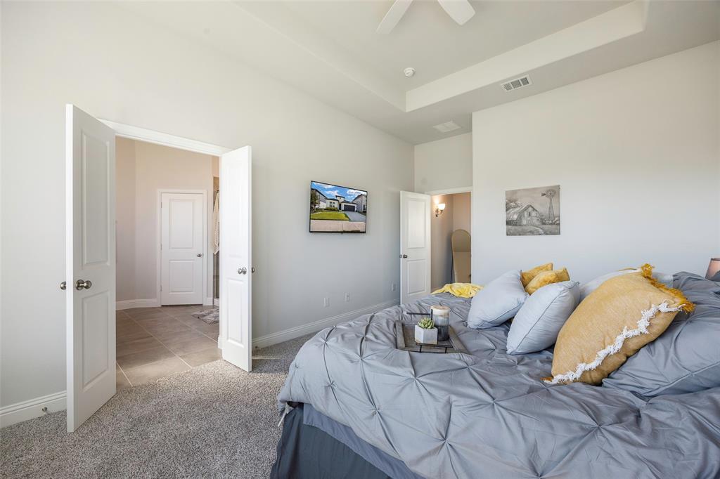 1617 Hitching Post Road Weston, TX 75009 - Photo 18 of 30 a bedroom with a bed and a couch