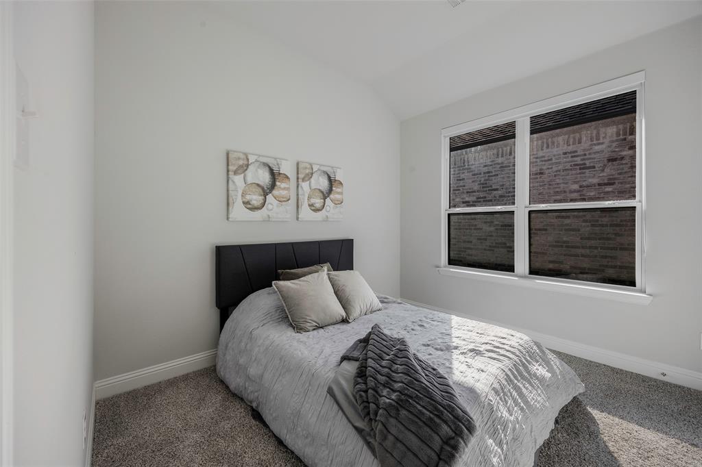 1617 Hitching Post Road Weston, TX 75009 - Photo 20 of 30 a bed sitting in a bedroom next to a window