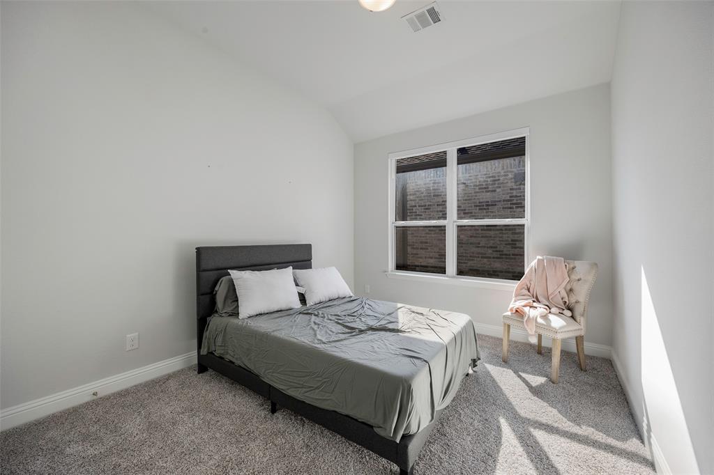1617 Hitching Post Road Weston, TX 75009 - Photo 23 of 30 a bedroom with a bed and window