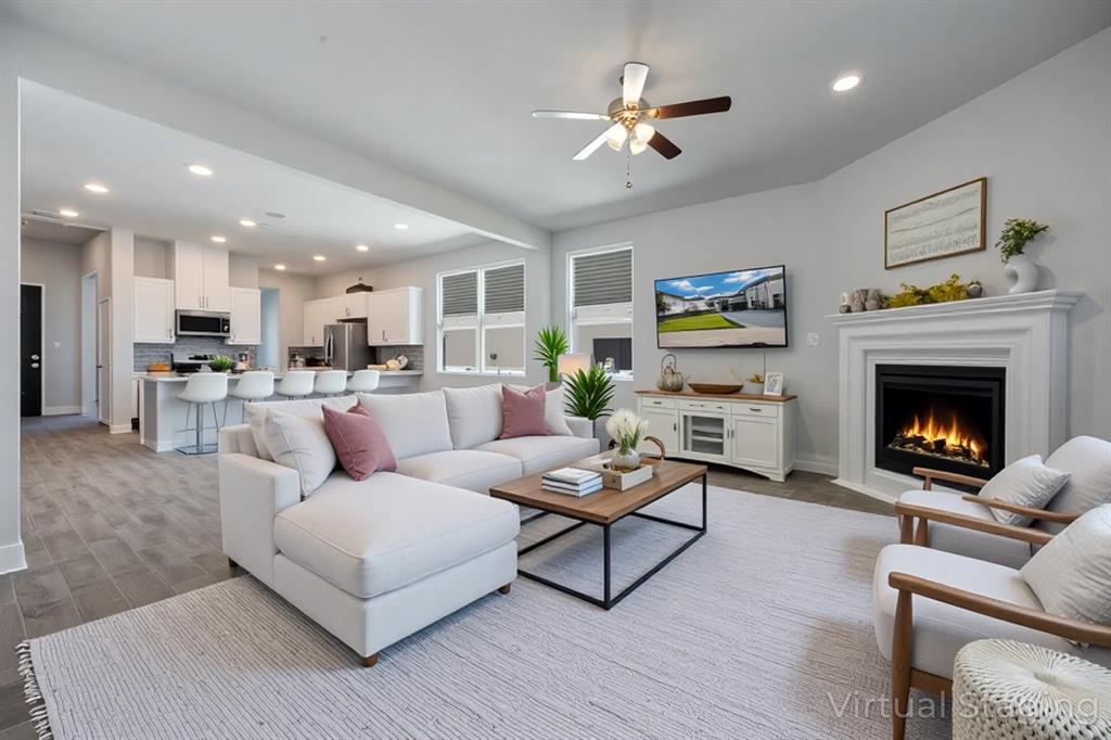 1617 Hitching Post Road Weston, TX 75009 - Photo 8 of 30 a living room with furniture and a fireplace