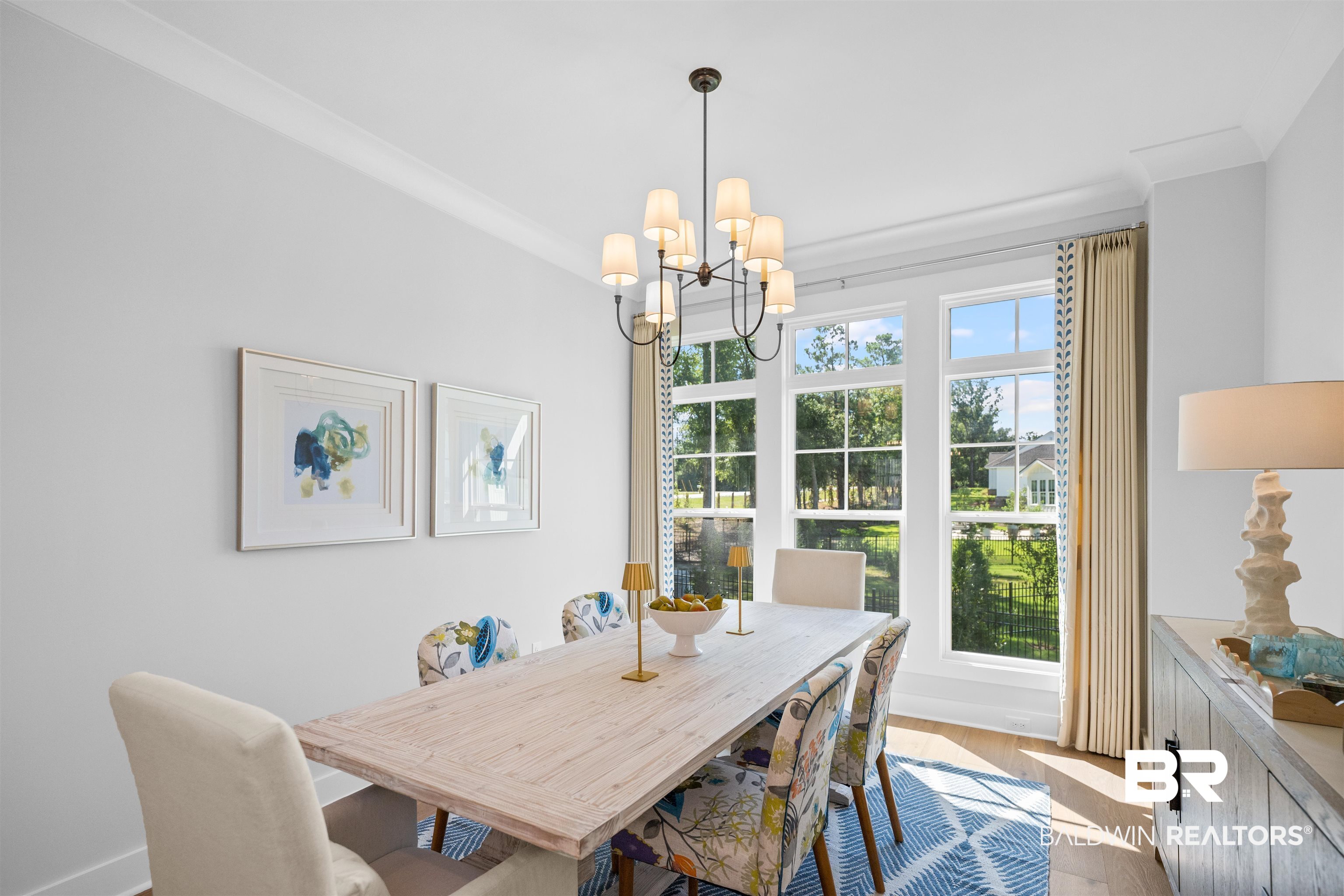 156 Hyacinth Street Fairhope, AL 36532 - Photo 17 of 61 Dining room featuring light wood-style floors and a chandelier