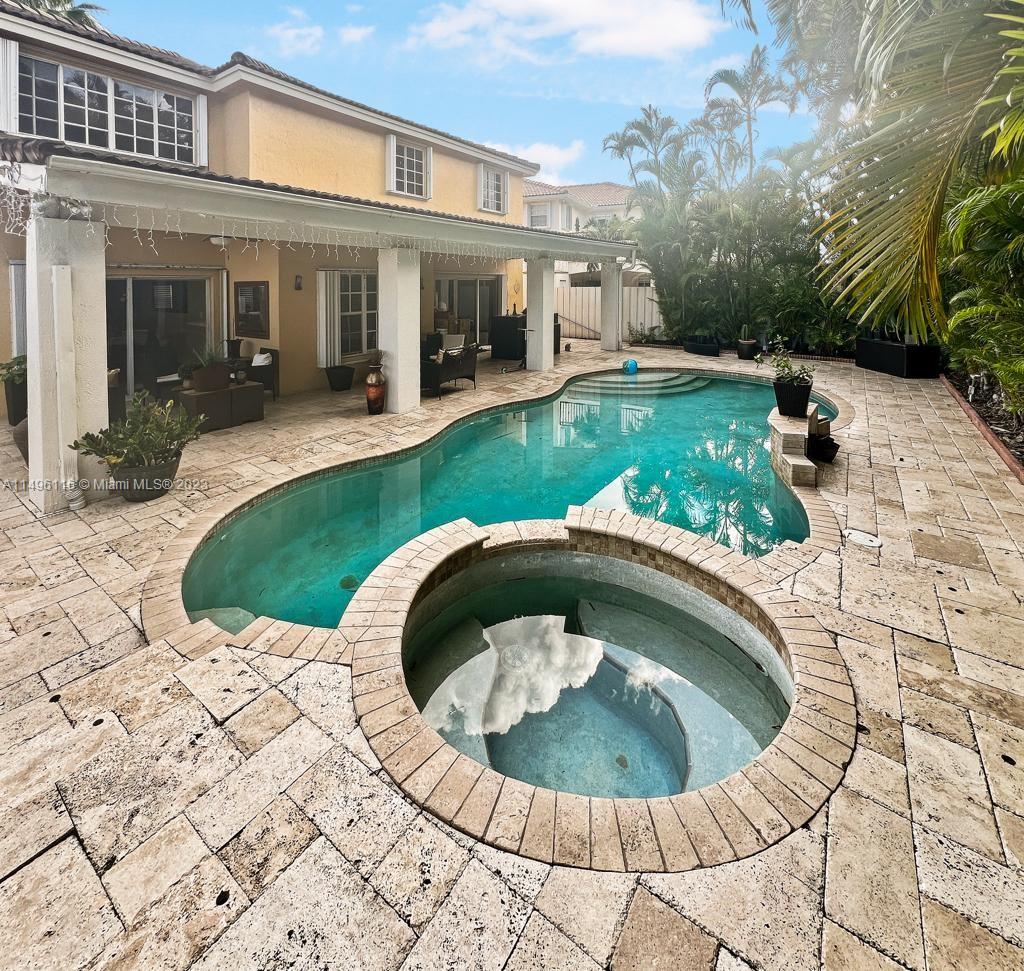 The Hammocks Miami, FL 33196 - Photo 18 of 20 a view of a house with a yard patio and fire pit