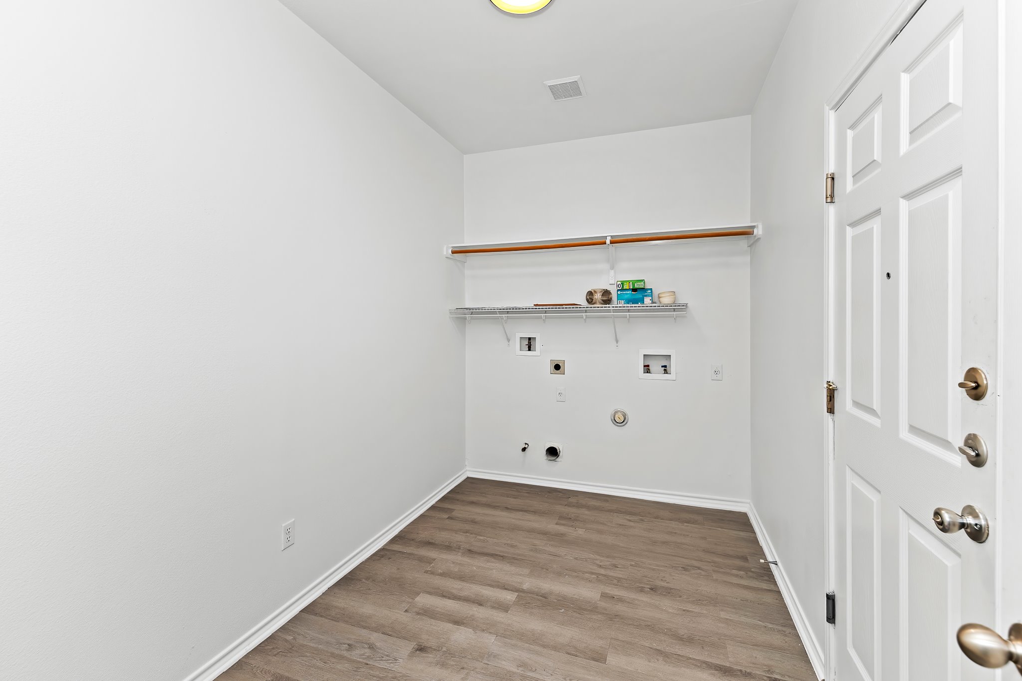 6700 Tulloch Way Austin, TX 78754 - Photo 21 of 39 a view of empty room with wooden floor