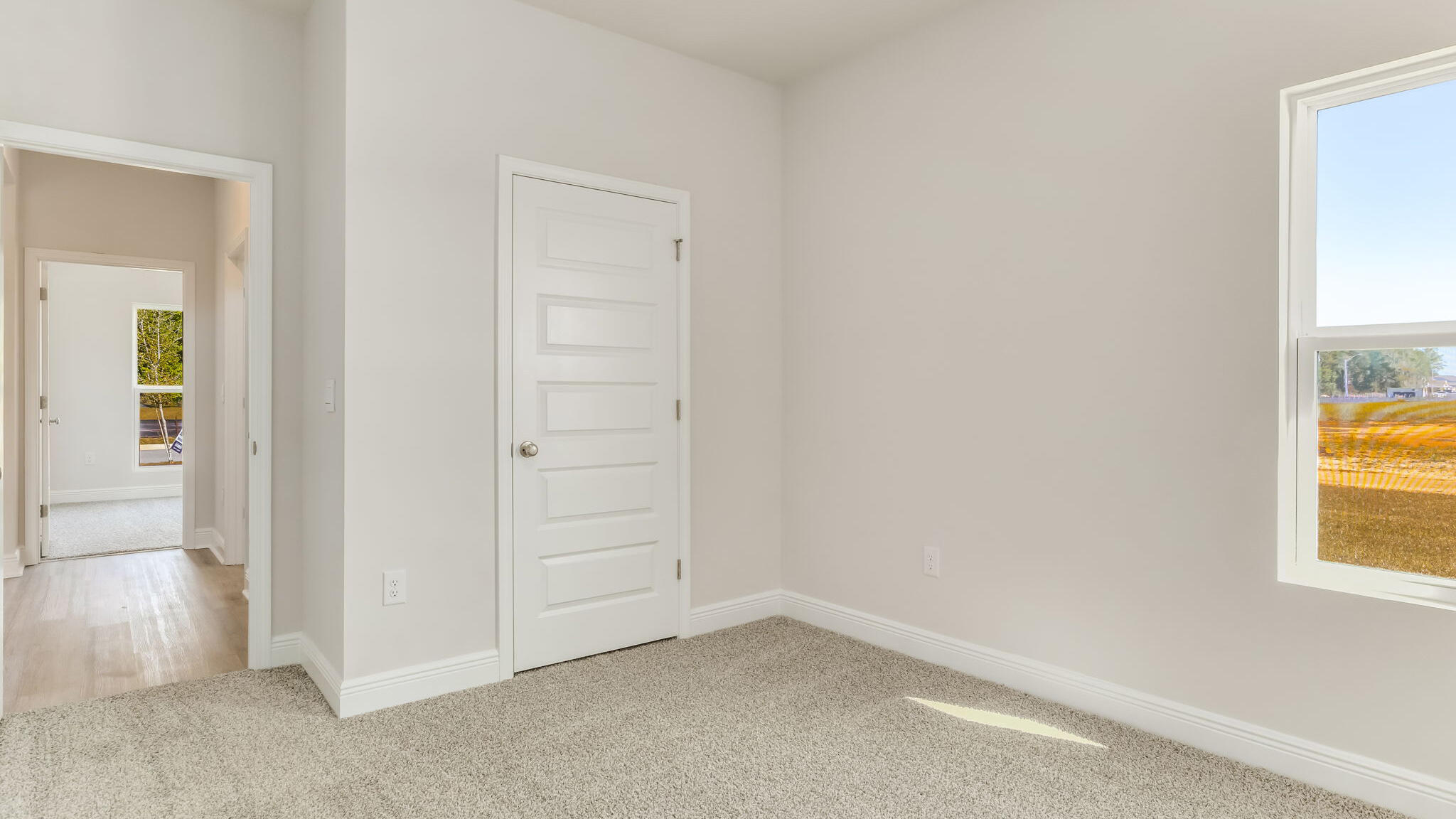 5619 Thatcher Road Crestview, FL 32539 - Photo 29 of 32 an empty room with windows and closet
